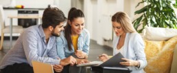 couple speaking with consultant at home