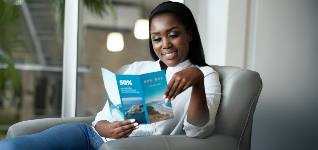 woman looking at travel brochure