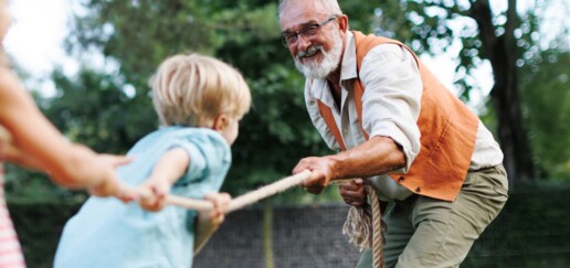 Man playing with grandchildren