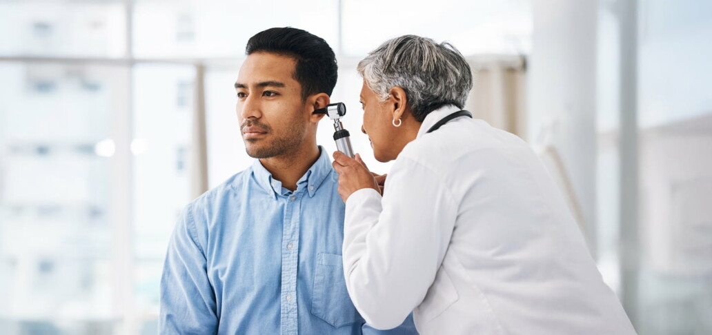 woman carrying out a hearing test on a man