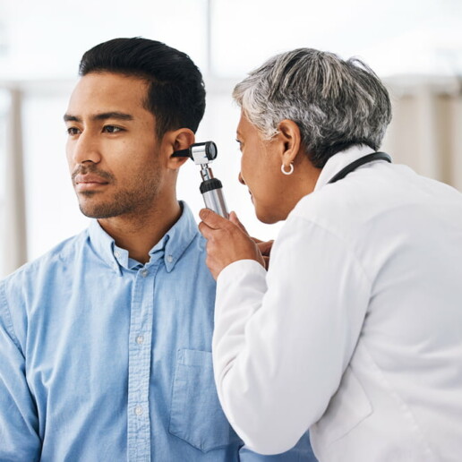 woman carrying out a hearing test on a man