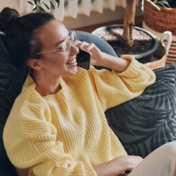 Woman on phone on beanbag chair
