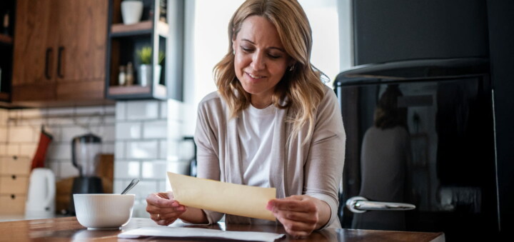 Women reading direct mail