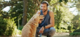 man with dog on run