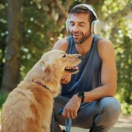 man with dog on run