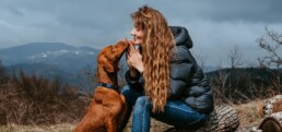 woman with dog in national park