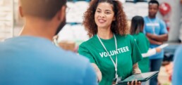 Smiling volunteer using a tablet